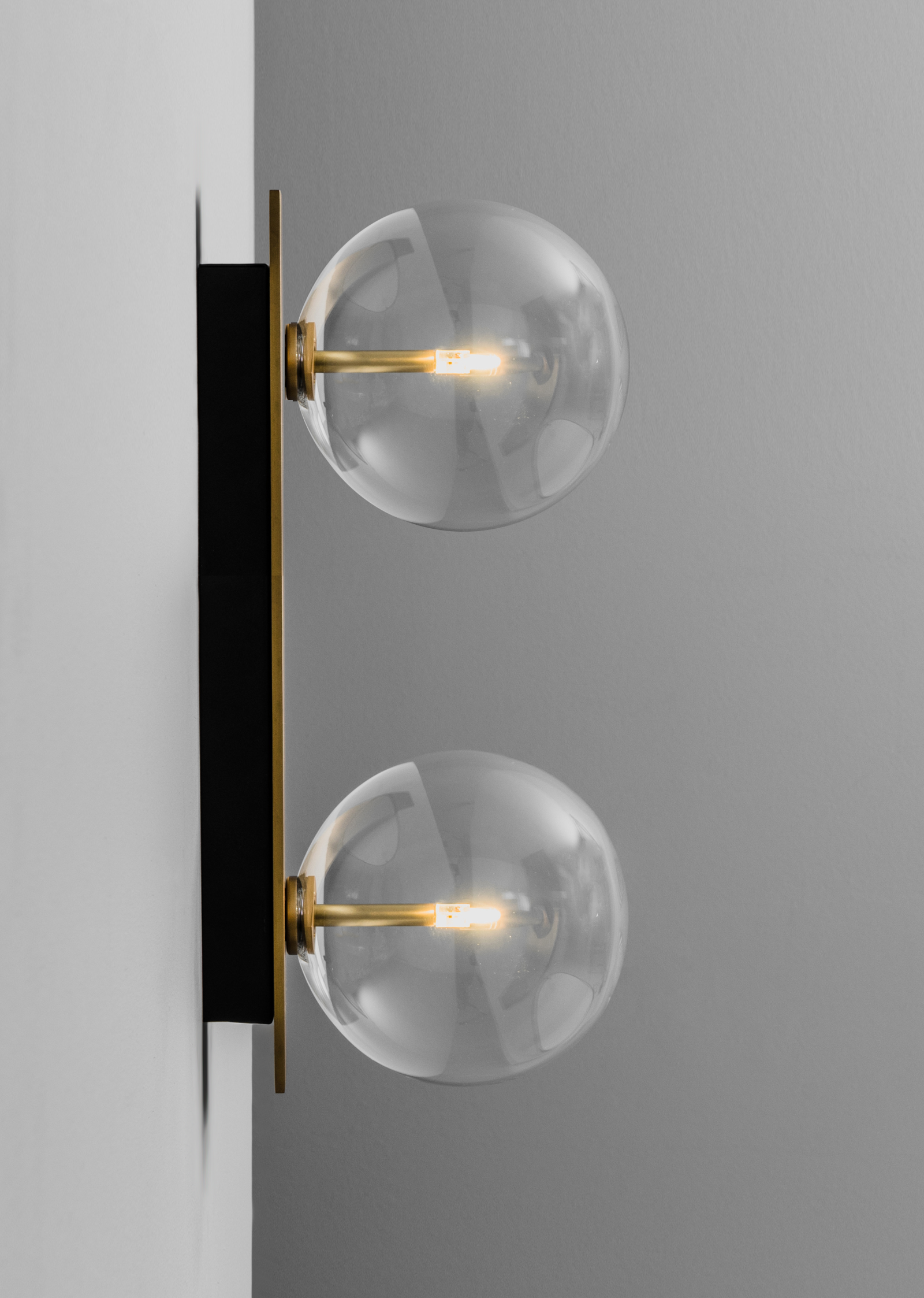 Schwung Oslo Dual Burnished Brass Transparent Globe Wall Light